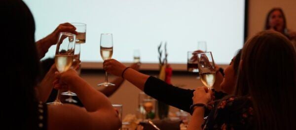 photo of (un)Common Logic team raising their glasses in celebration