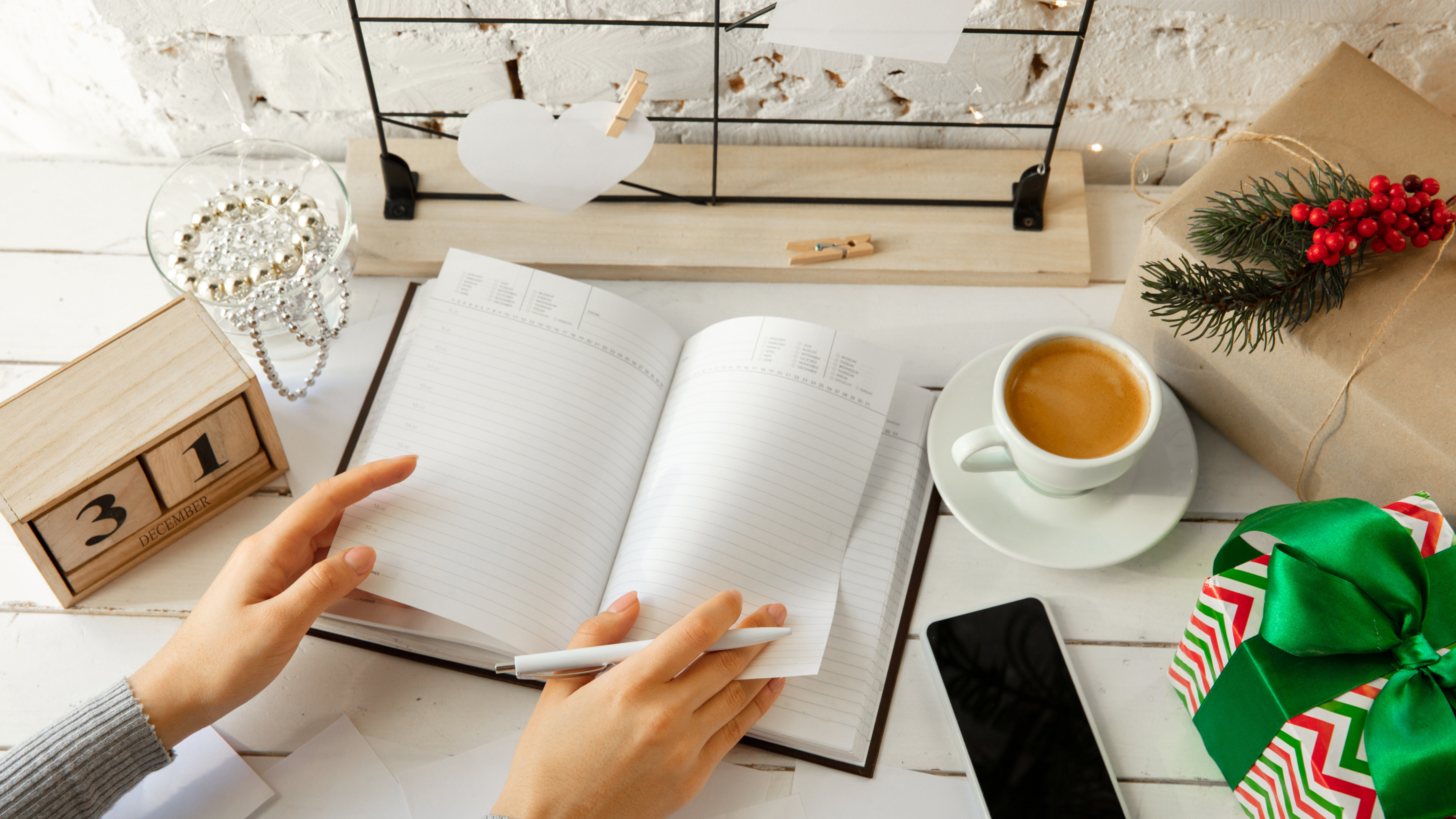 planner on a table with a december 31 sign, signifies planning for the year ahead